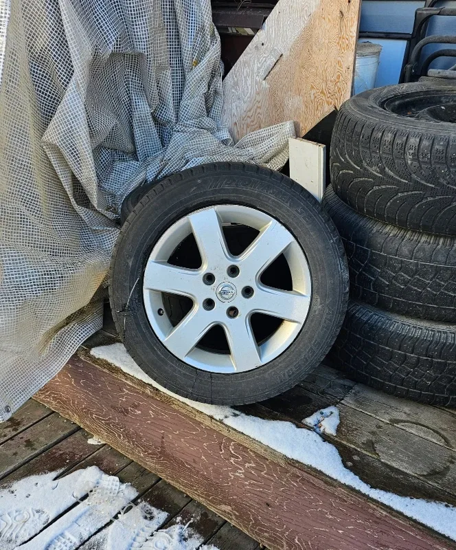 Four Toyota 15" Rims with Winter Tires 50% Tread Left