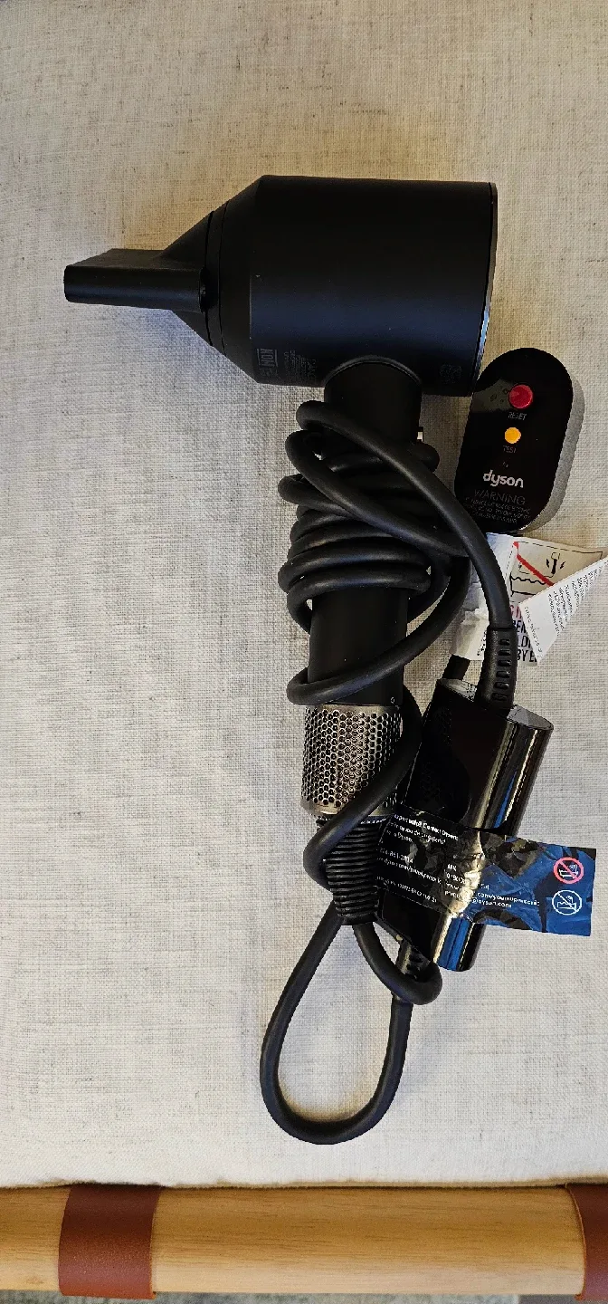 Dyson Supersonic hair dryer in matte black / nickel finish. image indicator(4)