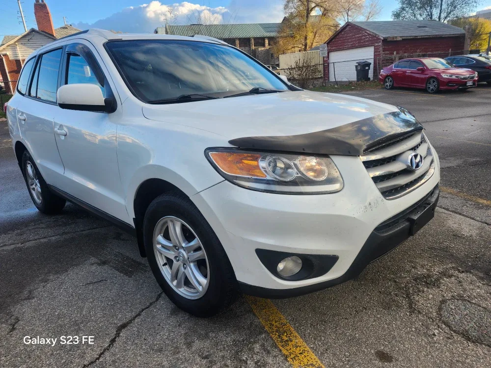 Lease-to-own white Hyundai Santa Fe.