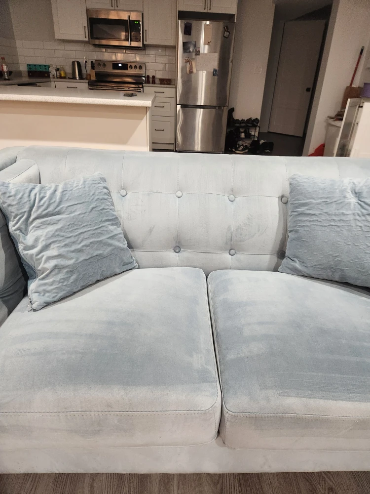 Light blue sofa with clear legs