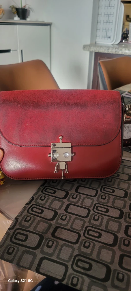 Well used Charles and Keith cross body bag