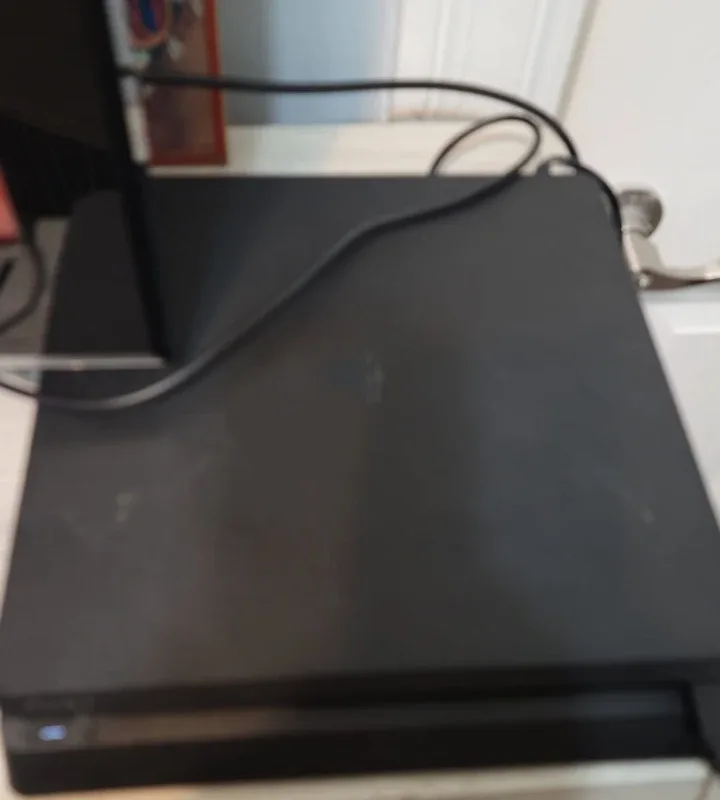 Sony PlayStation 4 Slim 1TB with Games image indicator(2)