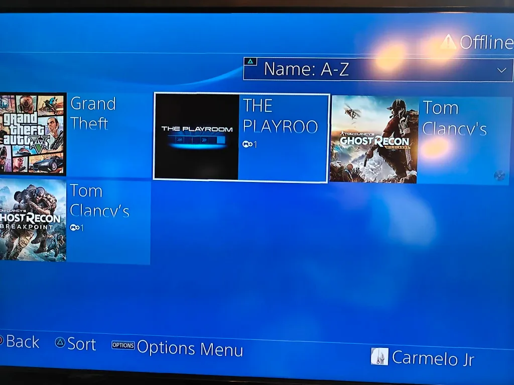 PS4 with a controller and GTA V, and 2 Tom Clancy games image indicator(2)