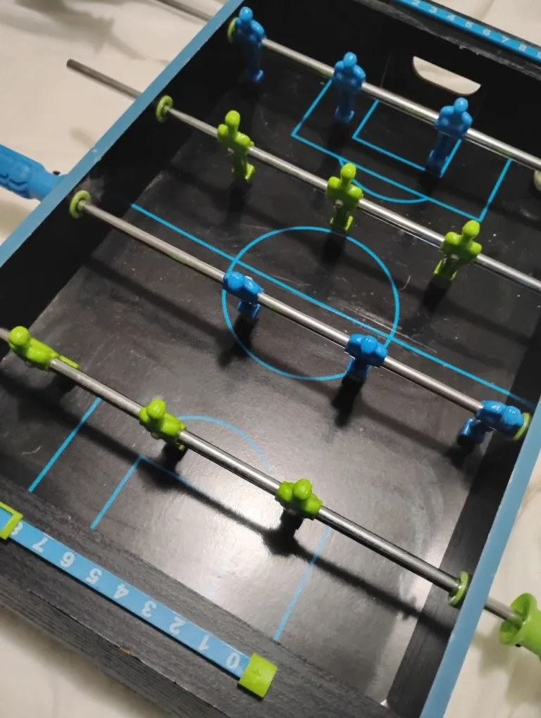 Mini foosball and mini hockey game.
