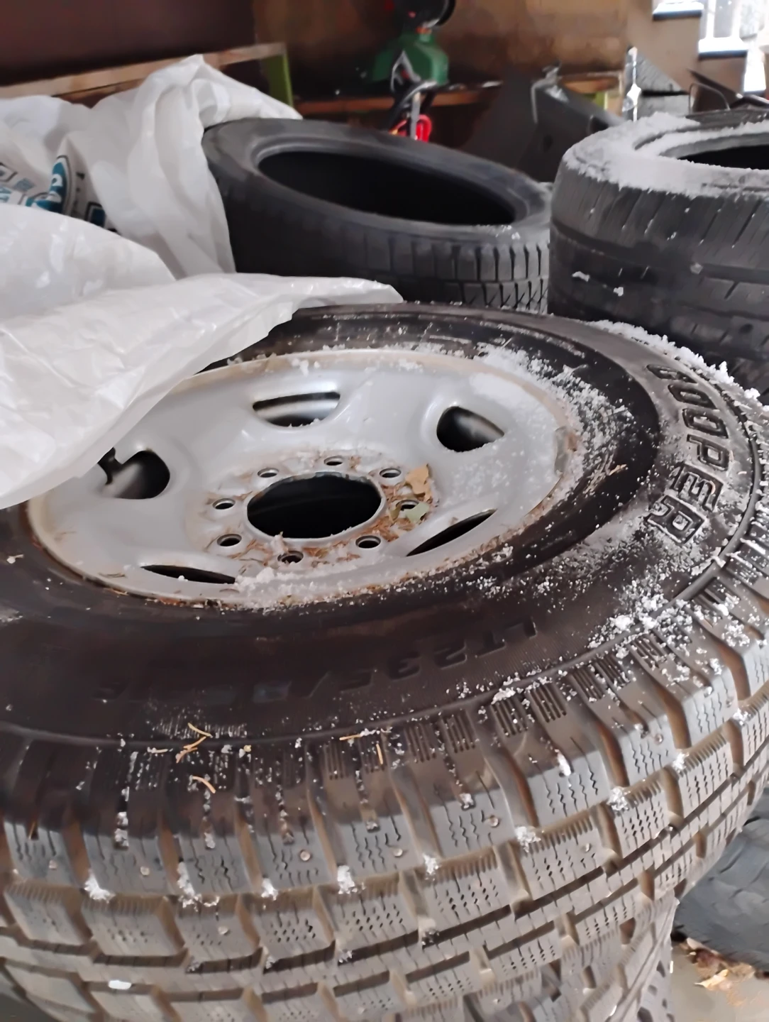 Set of 4 LT235/85R16 Cooper Studded Winter Tires on rims