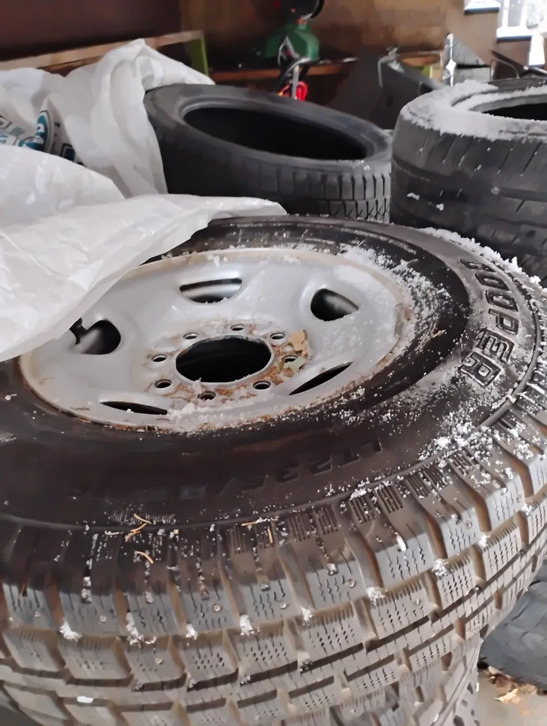 Set of 4 LT235/85R16 Cooper Studded Winter Tires on rims