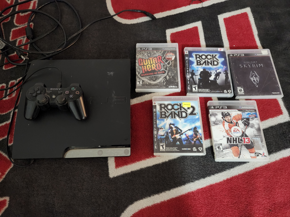 playstation 3 system with 4 games