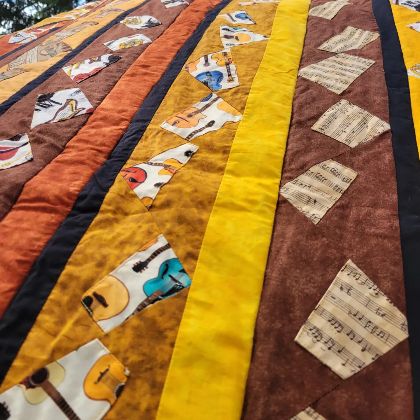 Handmade Quilted Blanket with Musical Instrument Design image indicator(9)