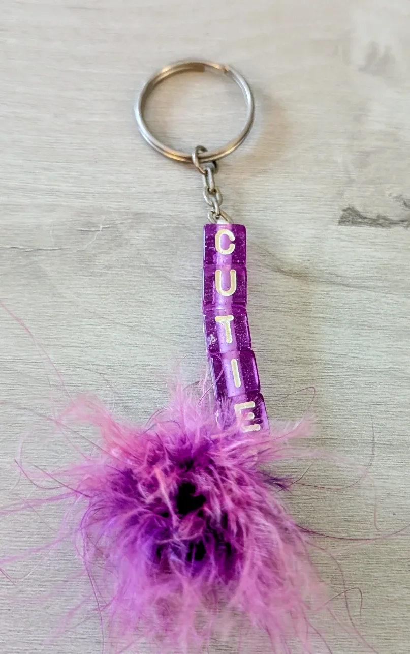 Brand New Purple 'Cutie' Keychain with Feathers