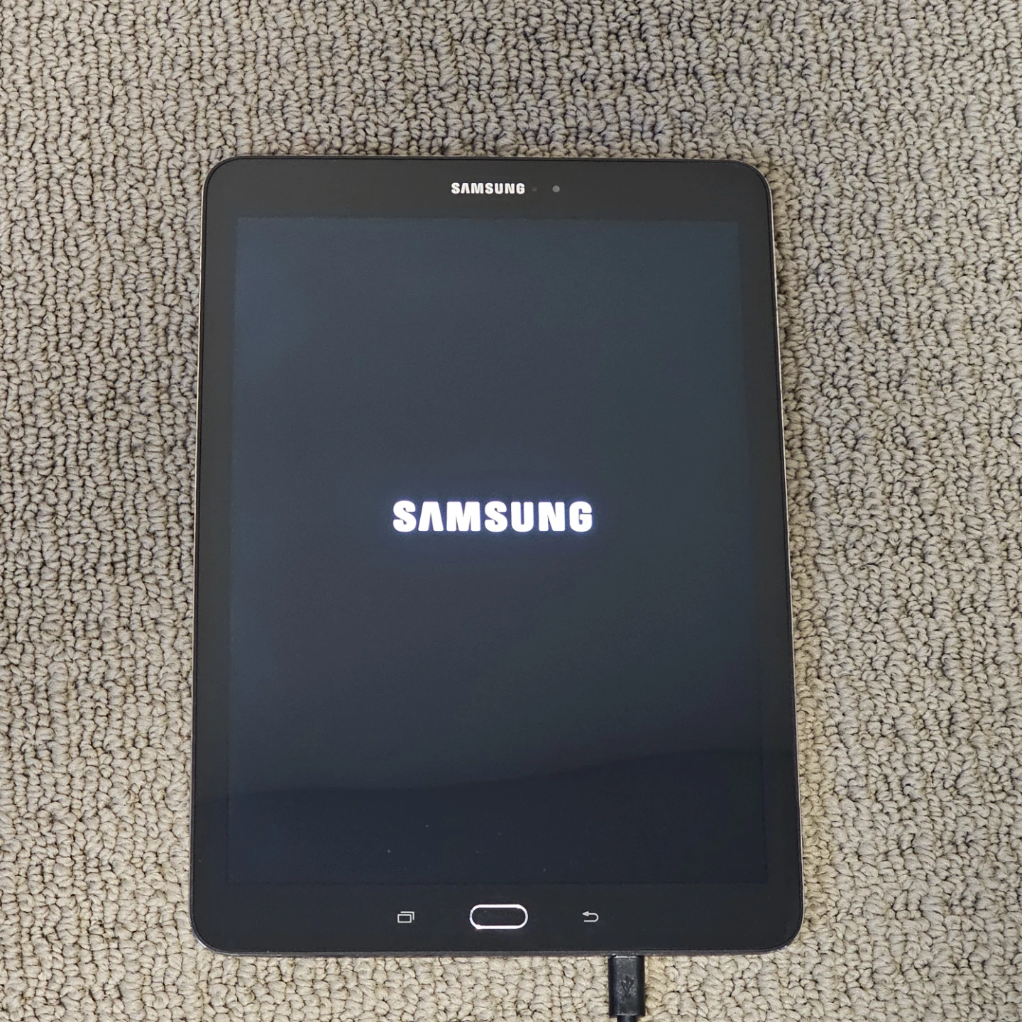Samsung Galaxy Tab S2 with case and charging cord