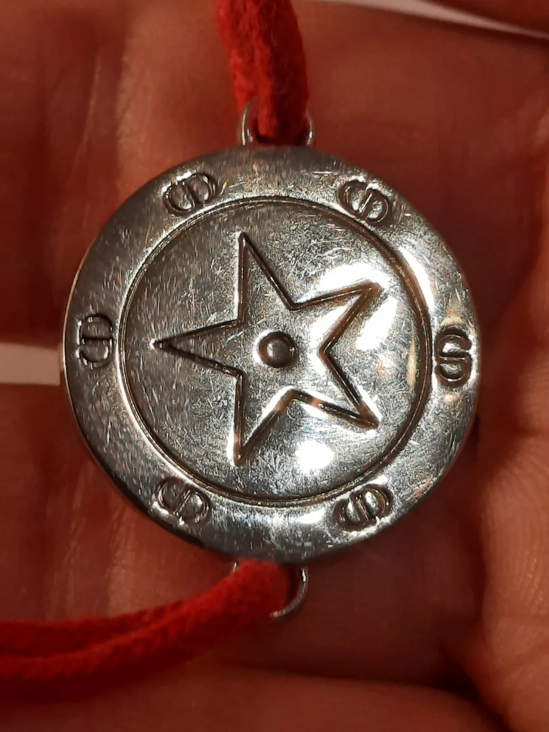 Cristian dior bracelet on red cord image indicator(8)