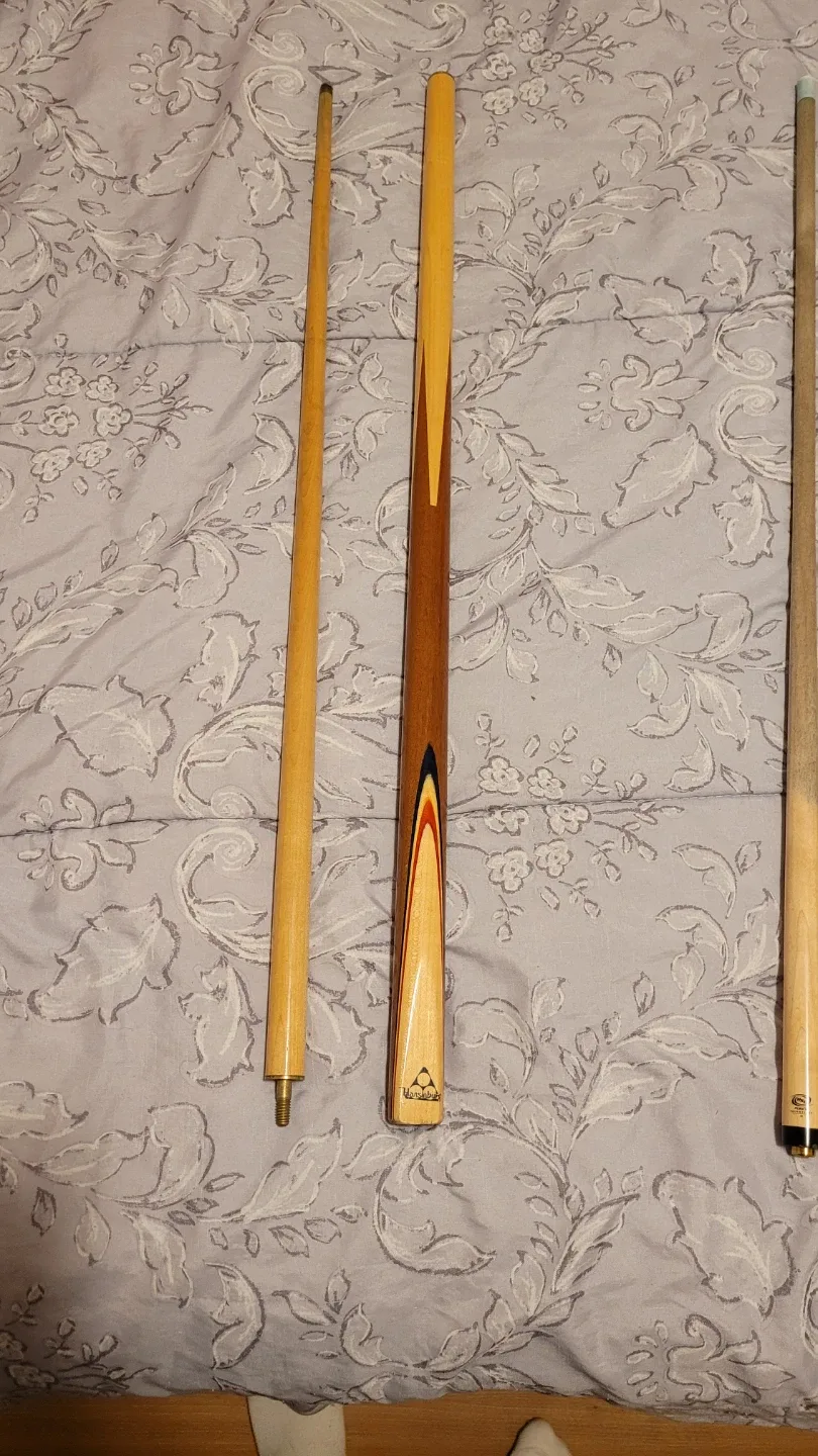 Variety of different pool cues image indicator(7)