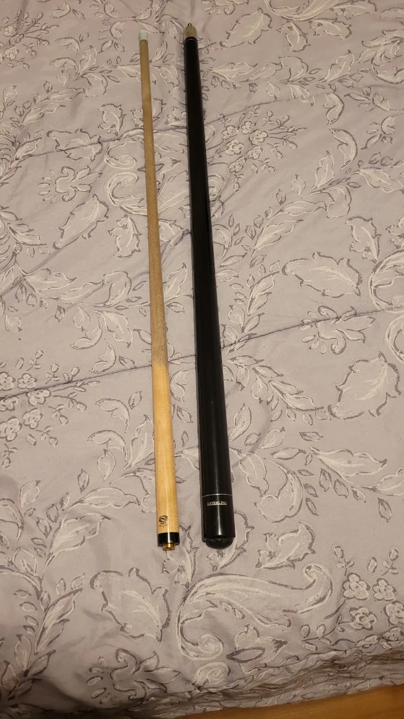 Variety of different pool cues image indicator(9)