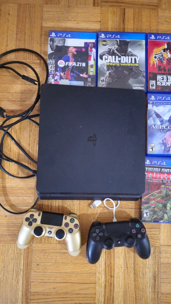 PlayStation 4 with Games and Controllers image indicator(2)