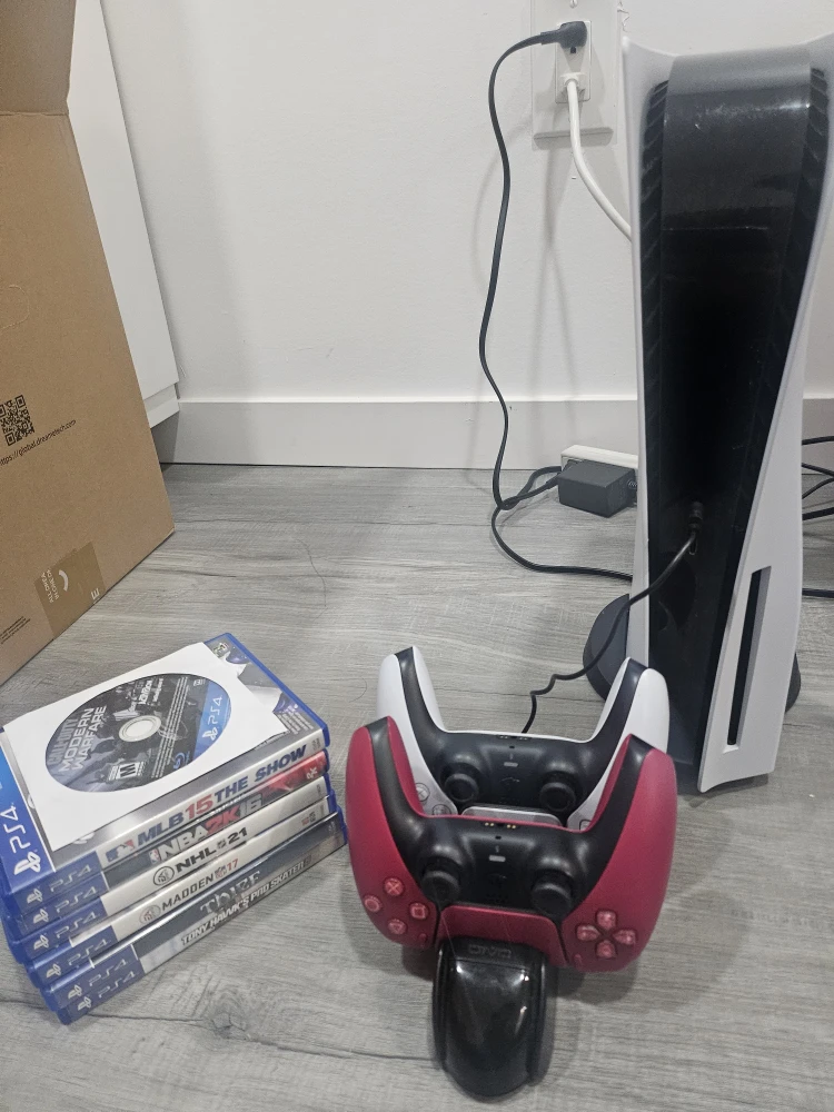 PS5 1TB console with 2 controllers + charger + 7 games