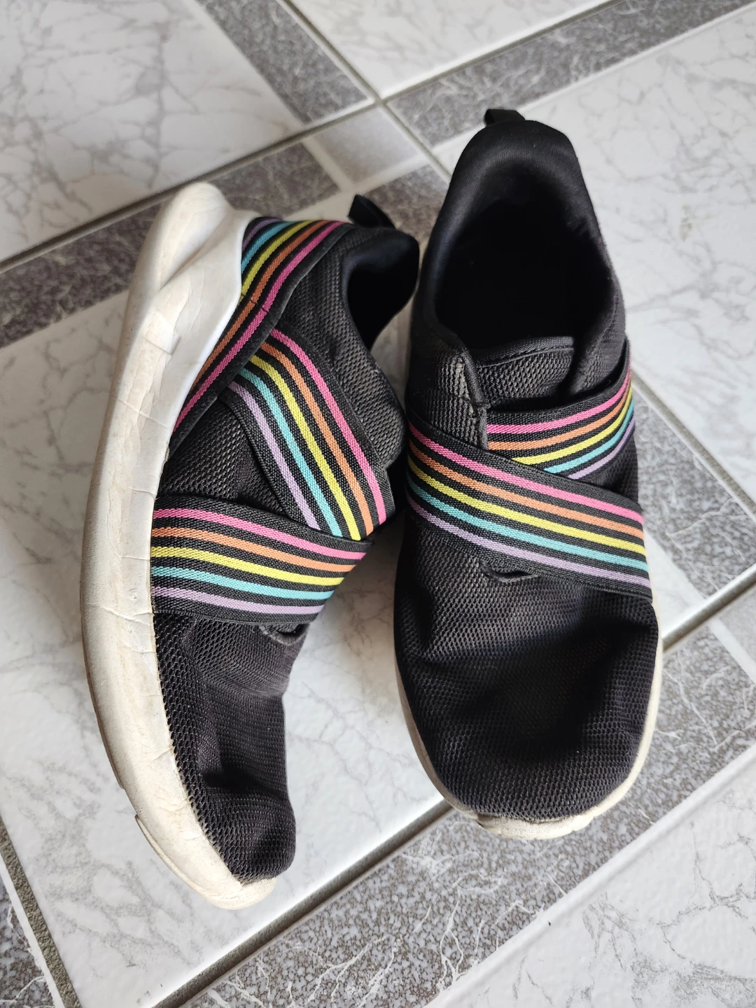 Slip on style shoes in youth size 5, also fit ladies size 6. 🙂