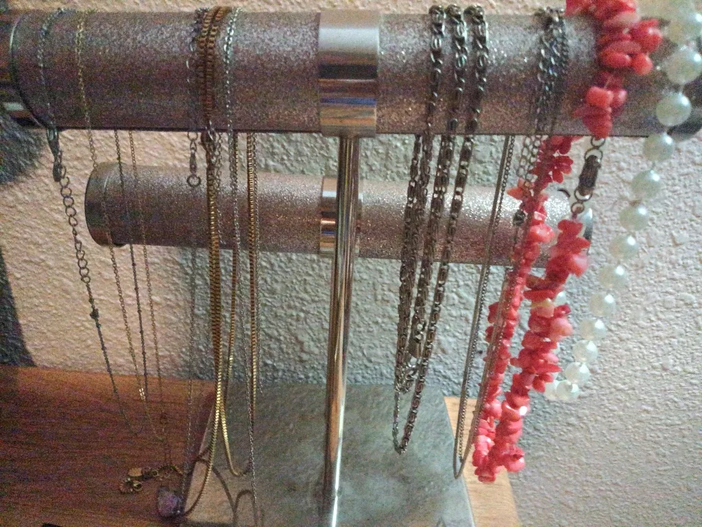 Assorted gold, silver, costume necklaces and charms