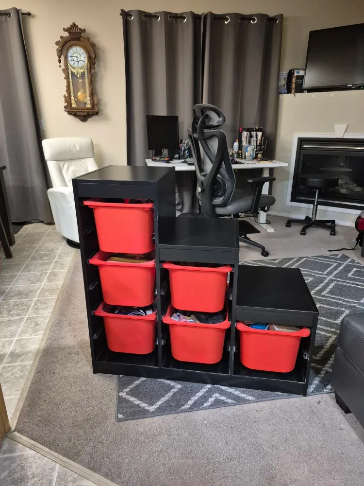 Black Storage Shelf with Red Bins