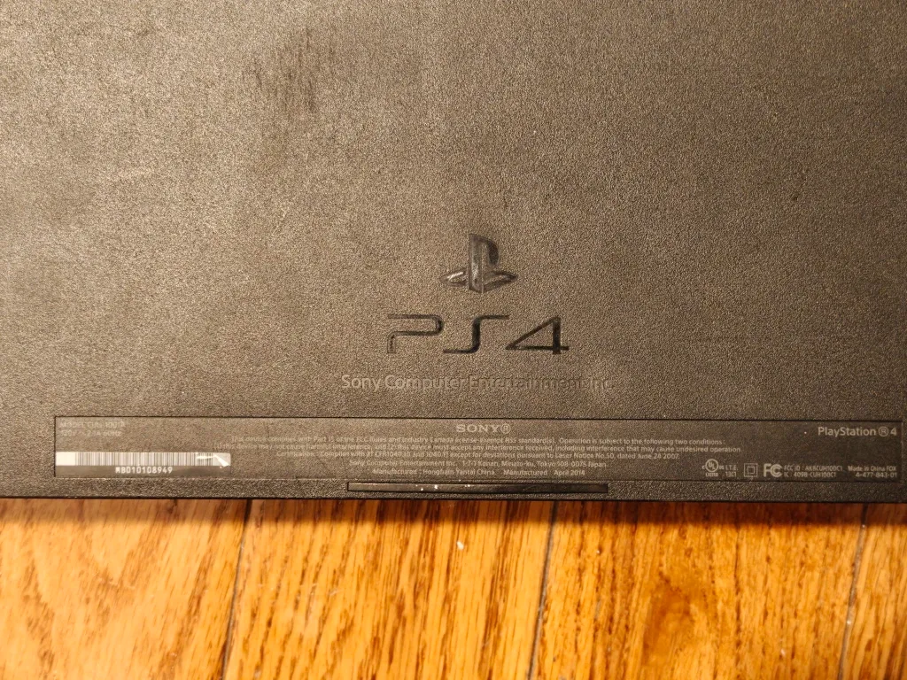 PS4 with a controller and GTA V, and 2 Tom Clancy games image indicator(3)