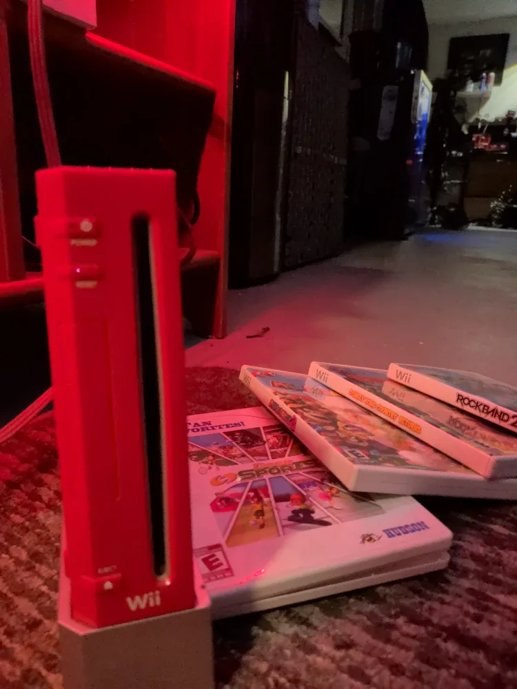 Red Nintendo Wii Console with Games image indicator(2)