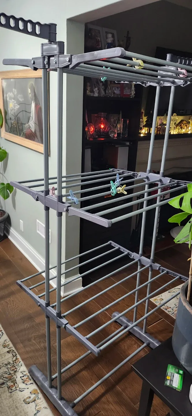 Grey Folding Clothes Drying Rack like new. Price no negotiable image indicator(2)