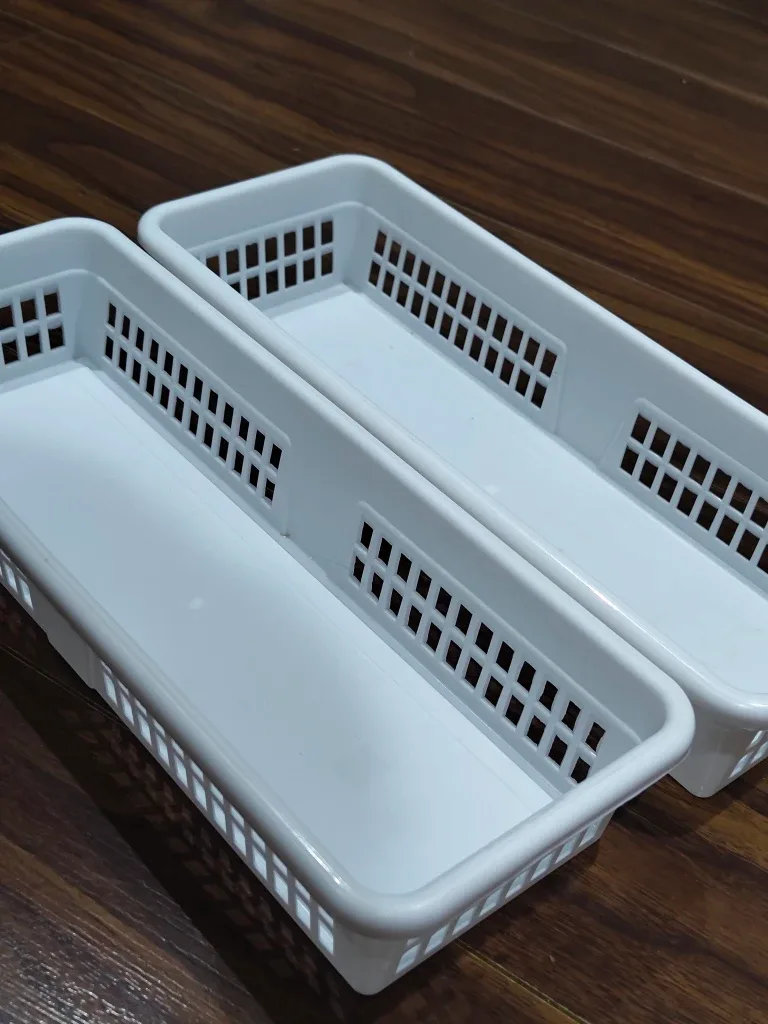 Two White Plastic Storage Bins