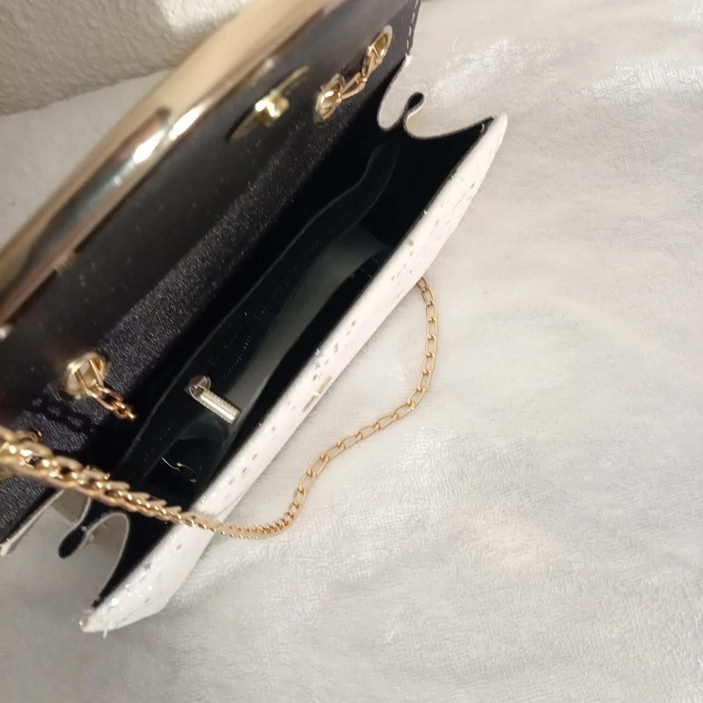 White & Gold Glitter Clutch with Chain Strap image indicator(2)