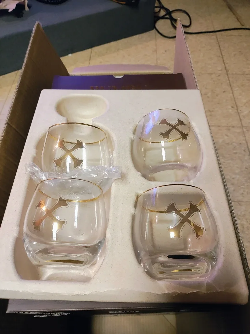 24 Bumbu Rum rocks glasses with a gold rim.