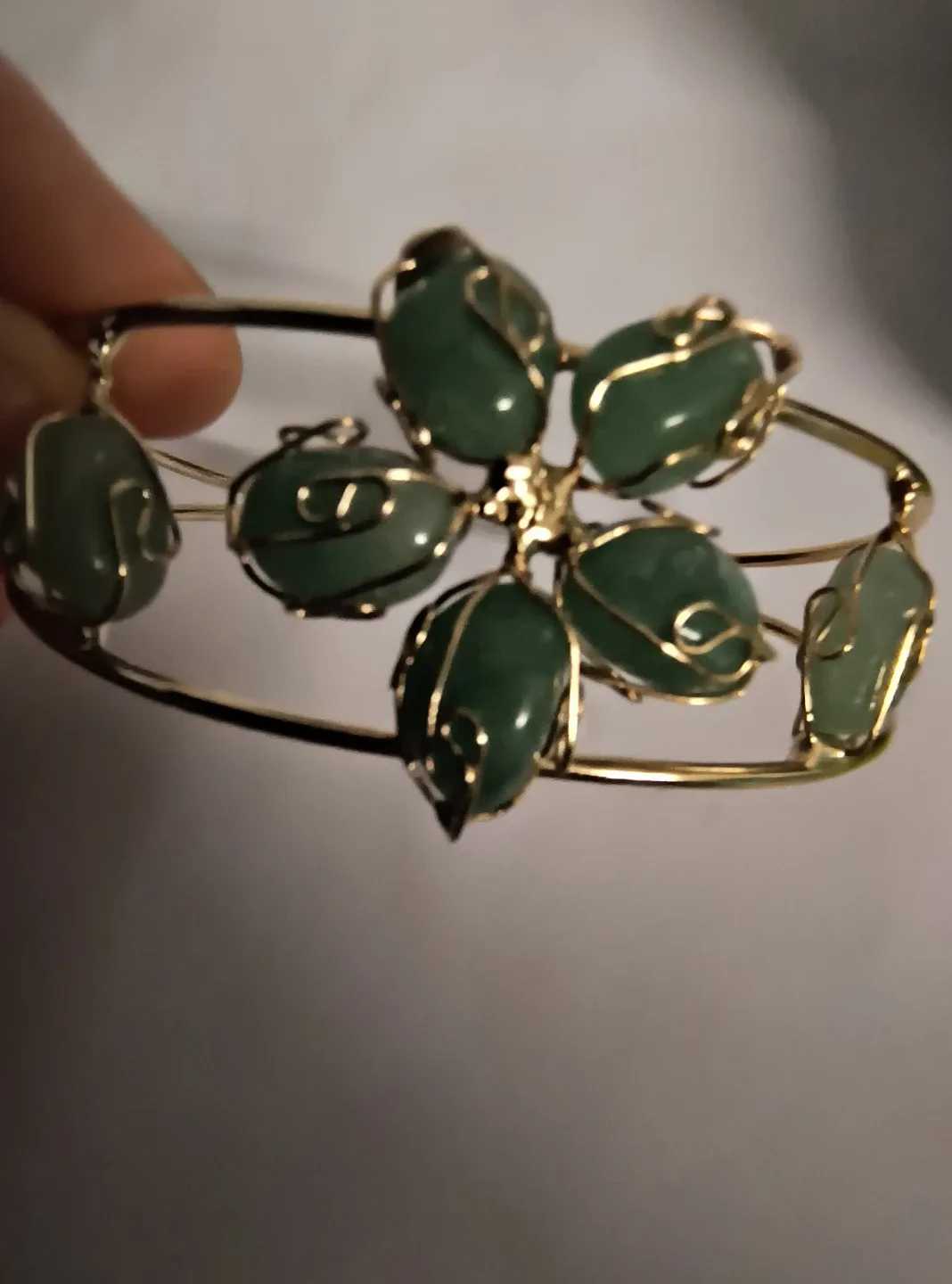 Gold Tone Bangle with Green Stone Accents. image indicator(2)