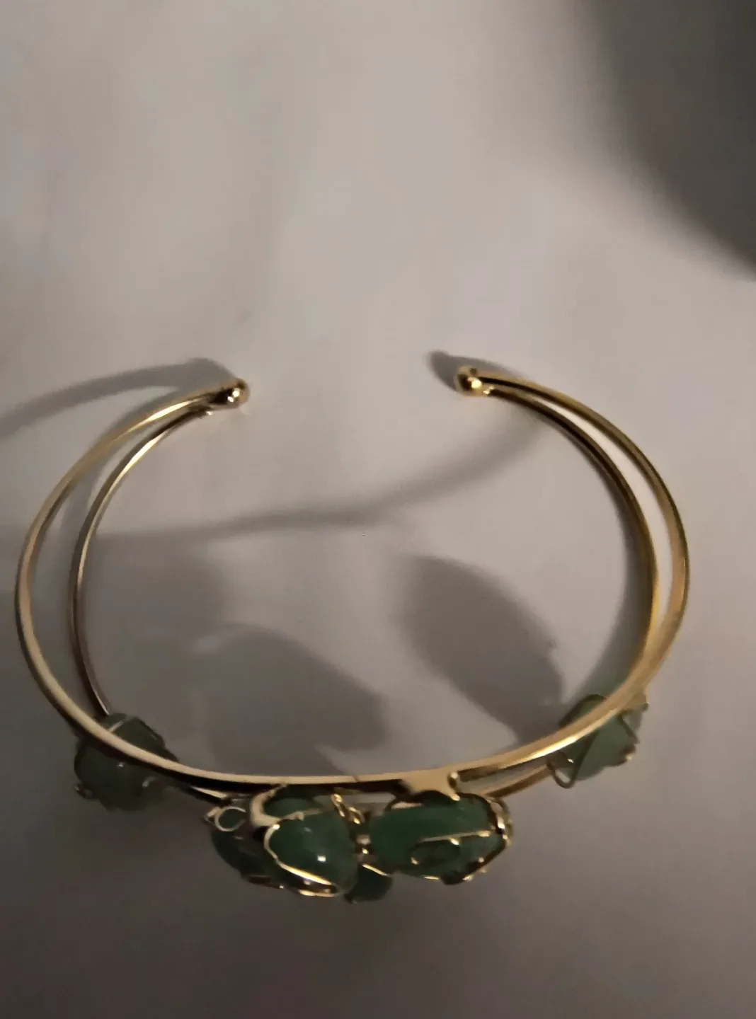 Gold Tone Bangle with Green Stone Accents. image indicator(3)