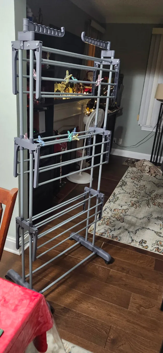 Grey Folding Clothes Drying Rack like new. Price no negotiable image indicator(3)