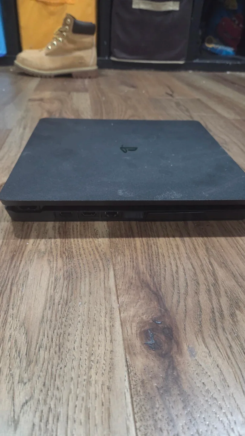 PlayStation 4 Slim with Games and Controllers image indicator(4)