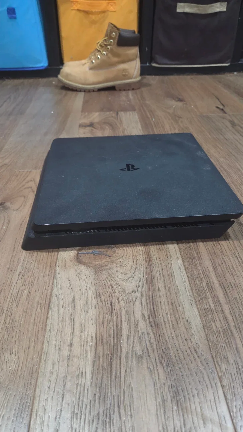 PlayStation 4 Slim with Games and Controllers image indicator(5)