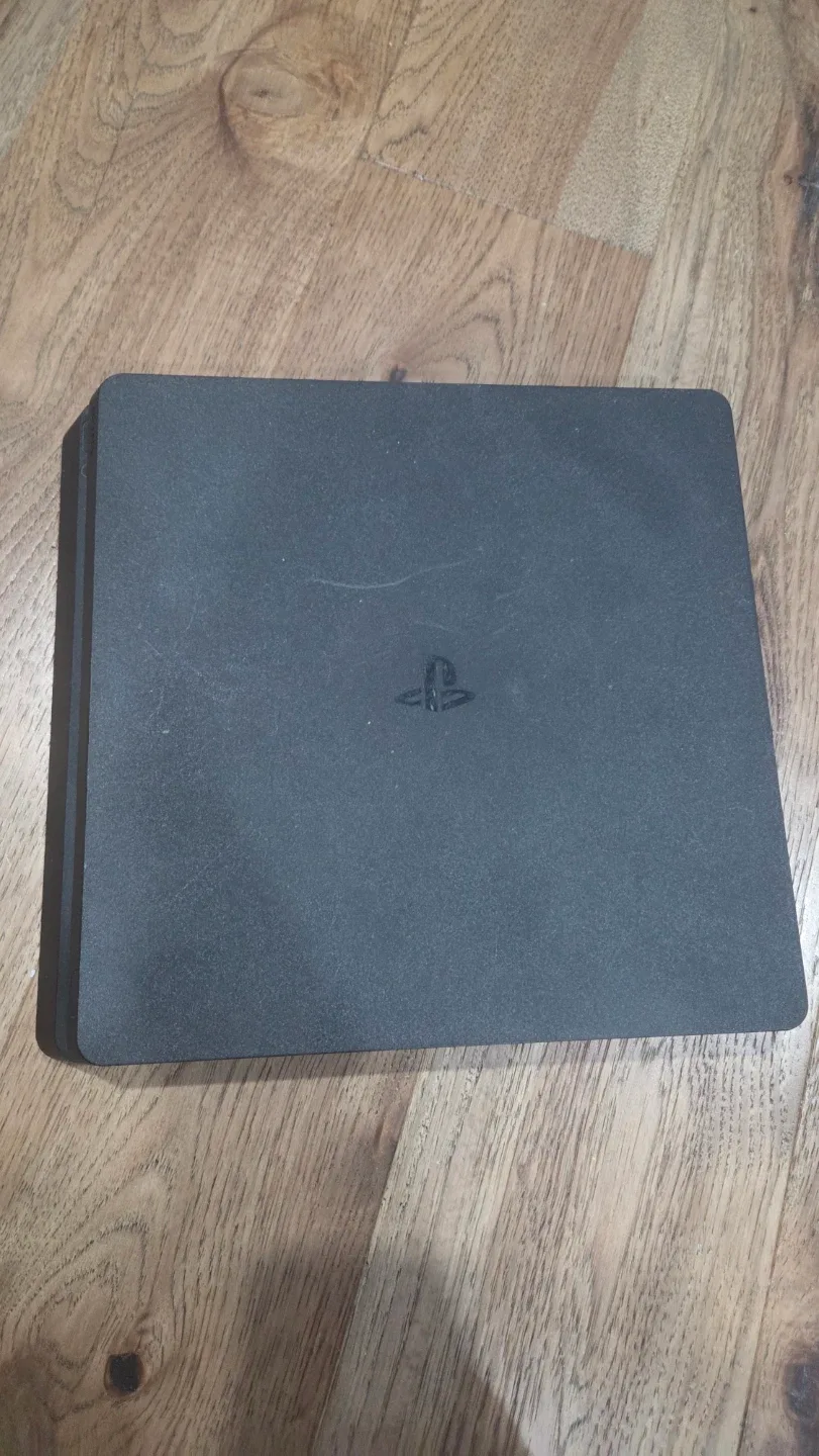 PlayStation 4 Slim with Games and Controllers image indicator(6)