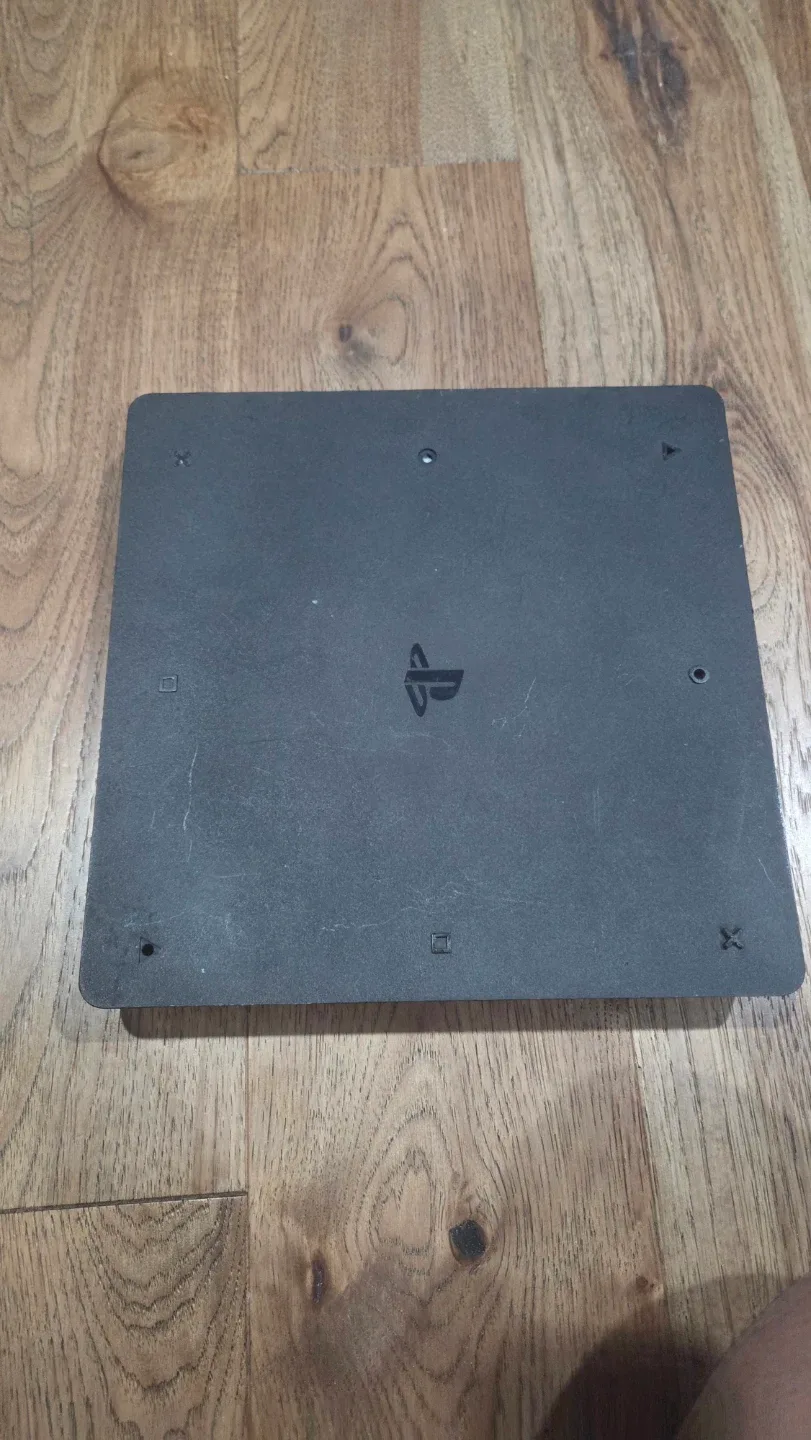 PlayStation 4 Slim with Games and Controllers image indicator(7)