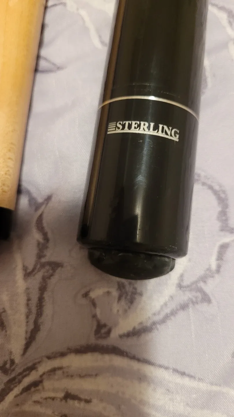 Variety of different pool cues image indicator(10)