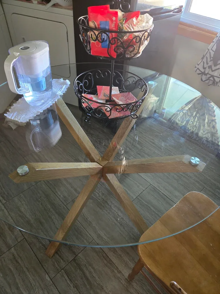 Glass table with a metal base inspired by wood. #Cleanout image indicator(2)