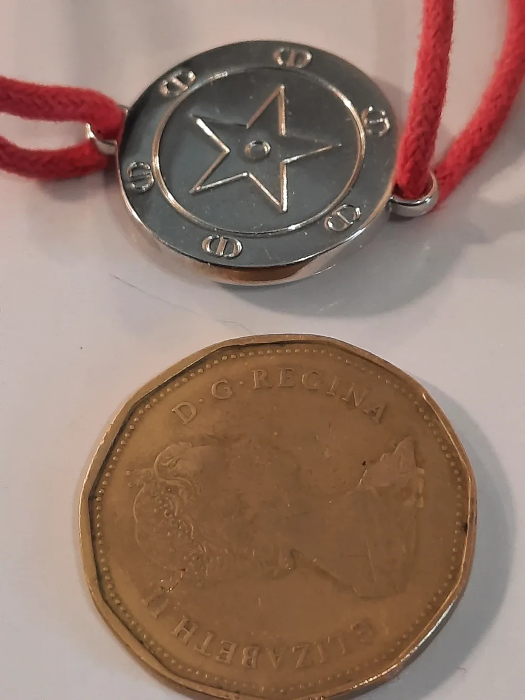 Cristian dior bracelet on red cord image indicator(7)