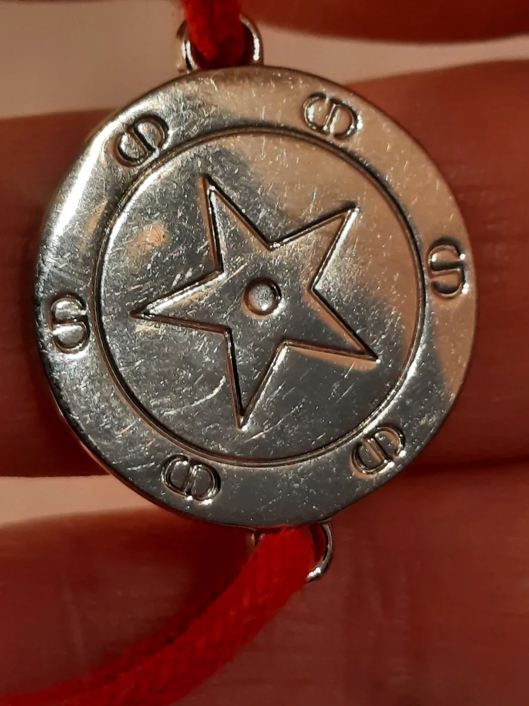 Cristian dior bracelet on red cord image indicator(2)