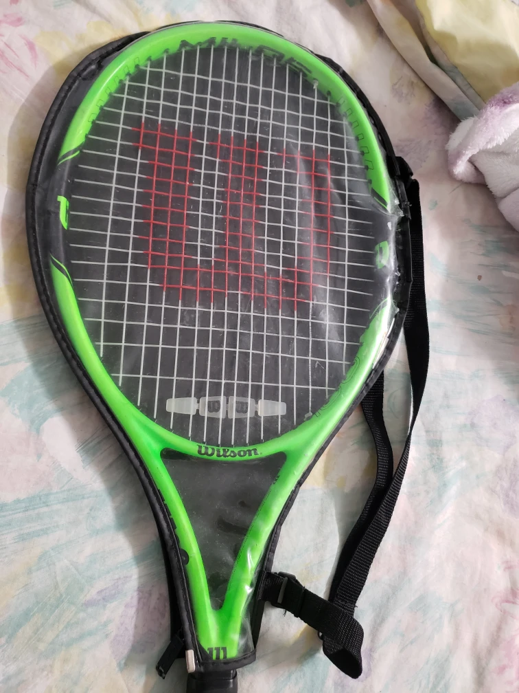 Wilson tennis racket with Pro Penn tennis balls