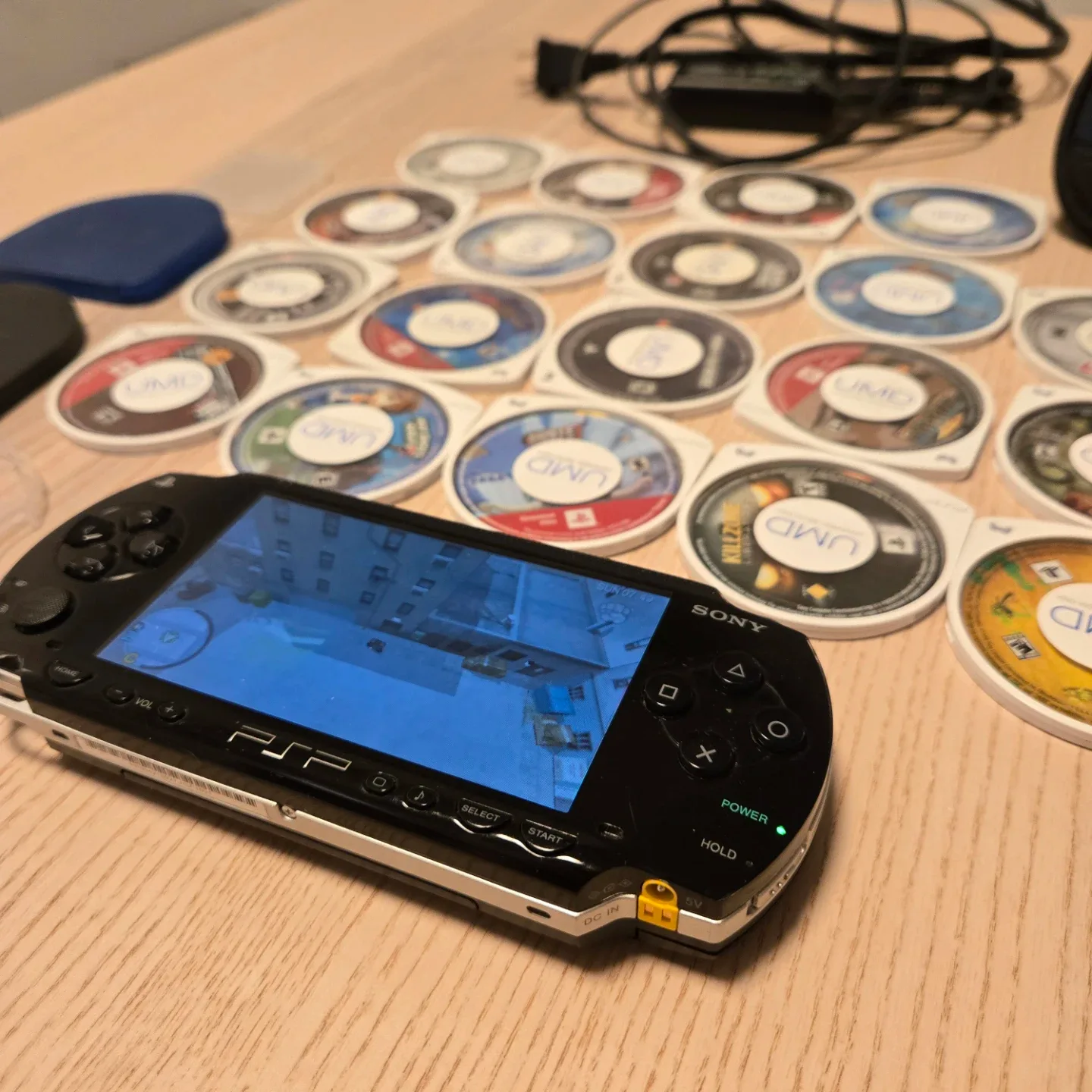 PSP 1001 lot. Original charger, battery, mem stick, case, games image indicator(2)