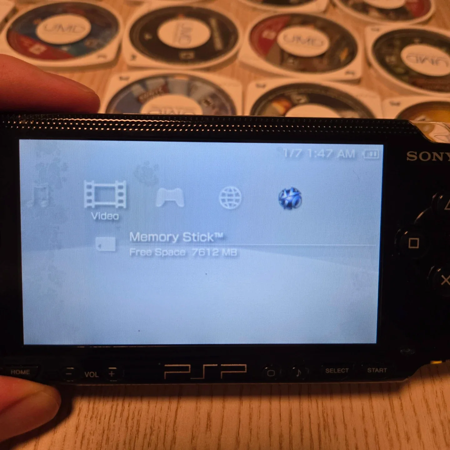 PSP 1001 lot. Original charger, battery, mem stick, case, games image indicator(8)