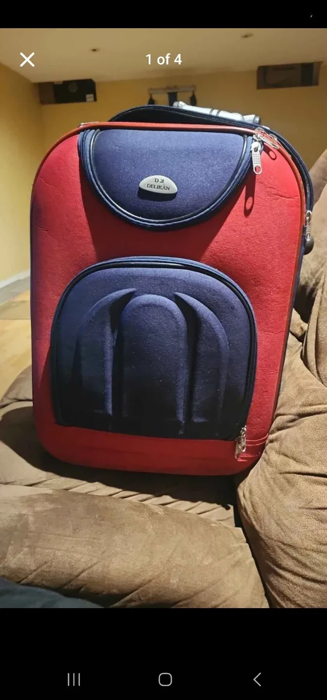 D.Z. Deegan Red & Navy Rolling Suitcase