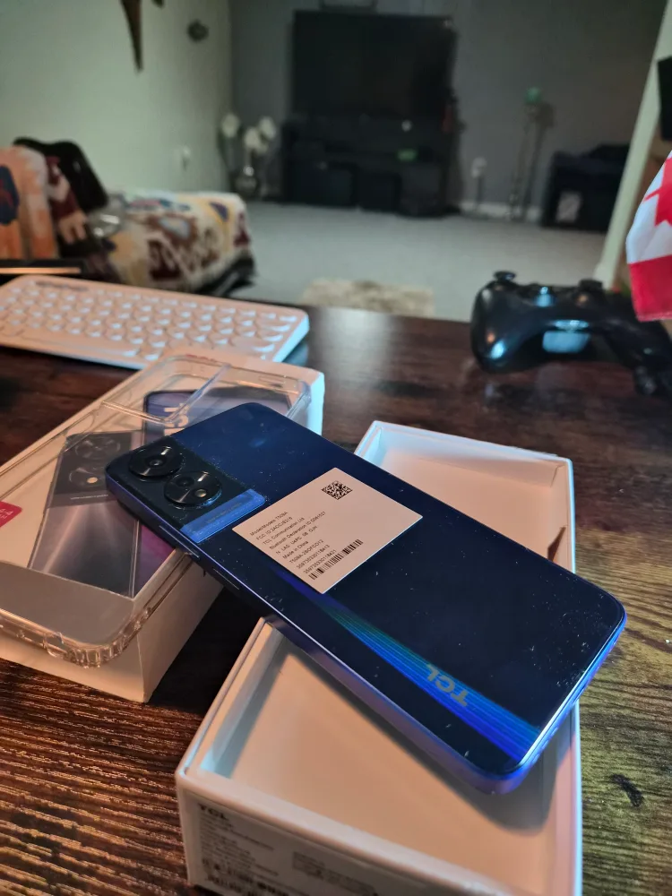 Open box, yet never used. TCL 505 Ocean Blue Smartphone image indicator(8)