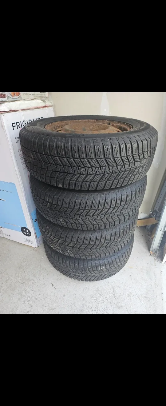 LIKE NEW WINTER TIRES WITH THE RIM. $115 EACH FIRM!