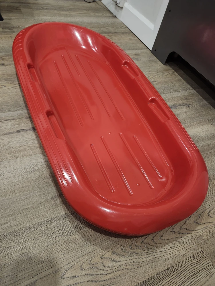 Red Plastic Toboggan Sled