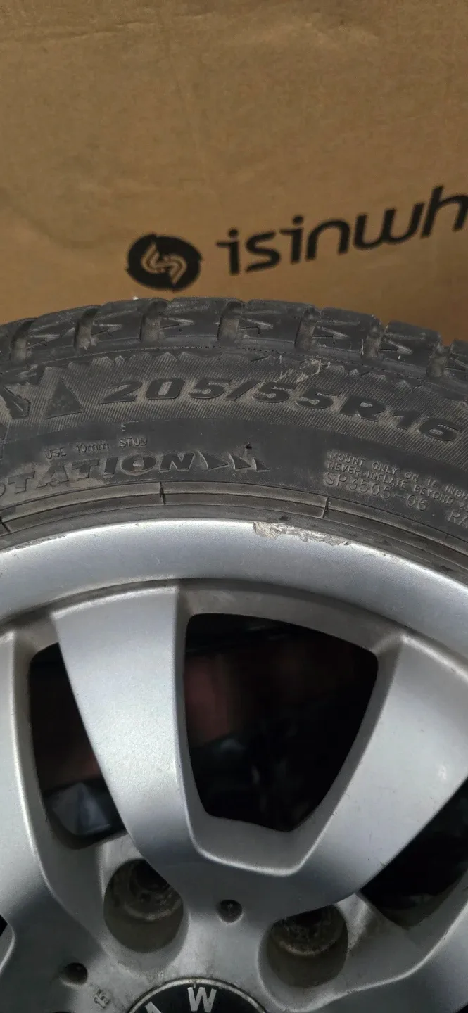 BMW Wheel with 205/55R16 studed tires. image indicator(2)