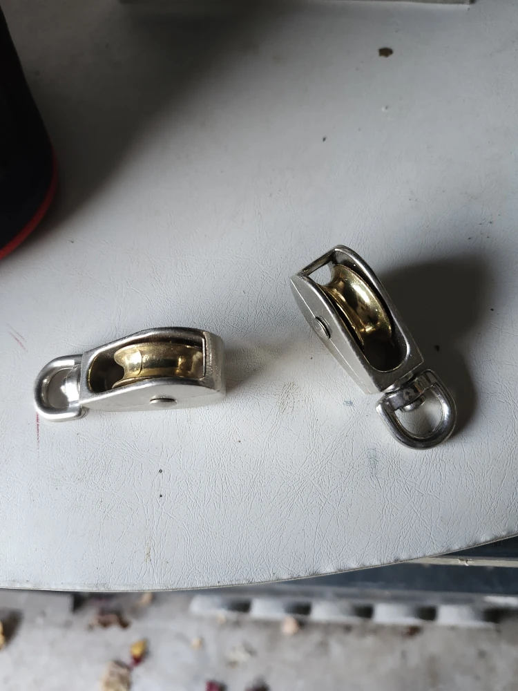 Two Small Silver Pulleys