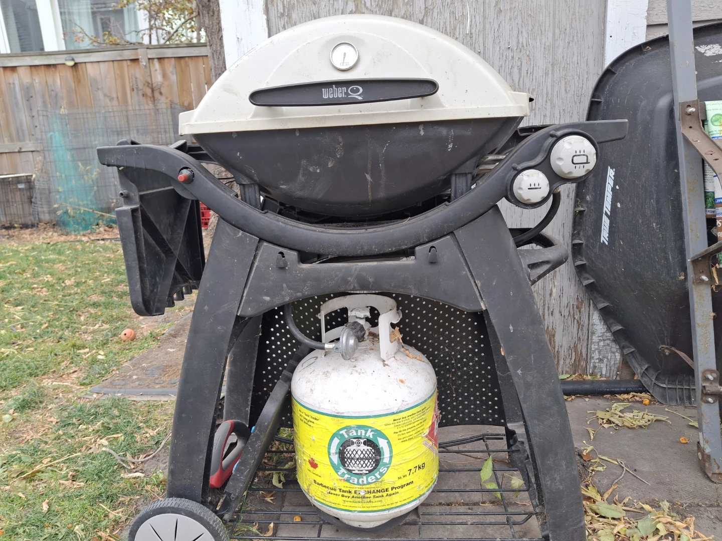 Weber Gas Grill on stand, with cover