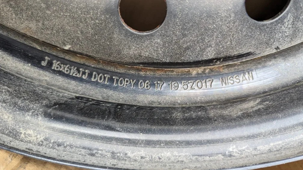 Original 16" Nissan Metal Rims with TPMS image indicator(2)